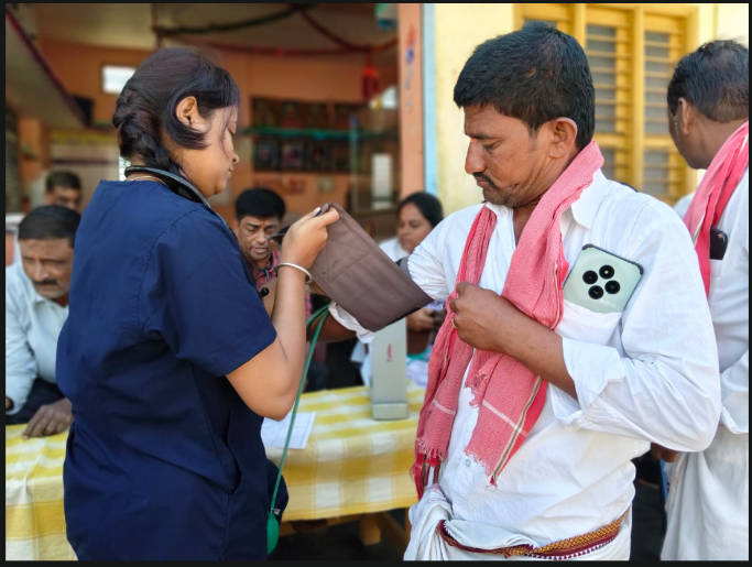 Blood pressure check at health camp